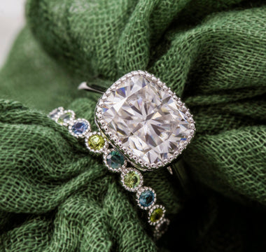 Two rings displayed on a green cloth background