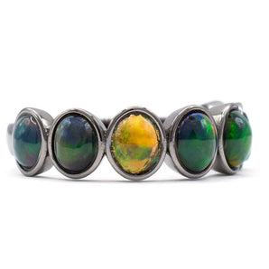 1.49 Carat Black Ethiopian Opal Seven-Stone Bezel Ring 14K Gold